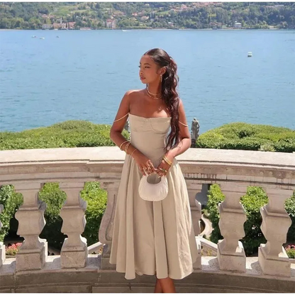Robe mi-longue élégante à bretelles spaghetti pour femme, tenue d'été sexy, dos nu, sans manches, avec grandes poches et ourlet, à la mode, pour soirées et clubs 
