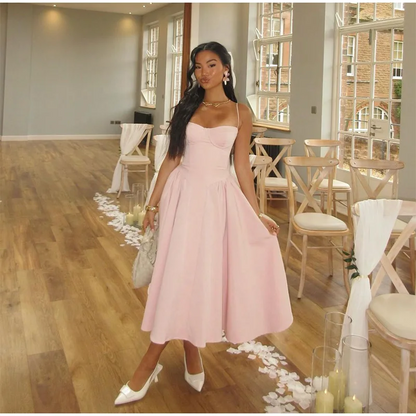 Robe mi-longue élégante à bretelles spaghetti pour femme, tenue d'été sexy, dos nu, sans manches, avec grandes poches et ourlet, à la mode, pour soirées et clubs